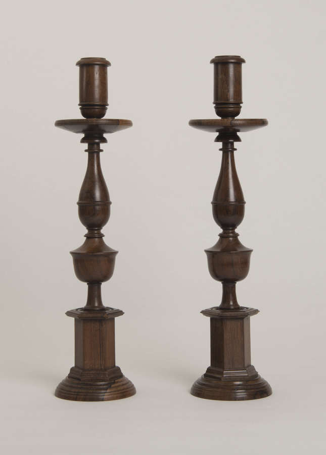 PAIR OF ANGLO INDIAN TURNED ROSEWOOD CANDLESTICKS